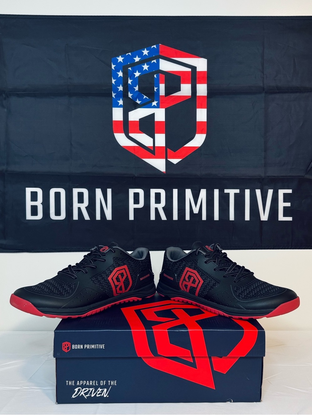 Brand new men's size 12.5 Born Primitive Savage 1 training shoes, red and black.